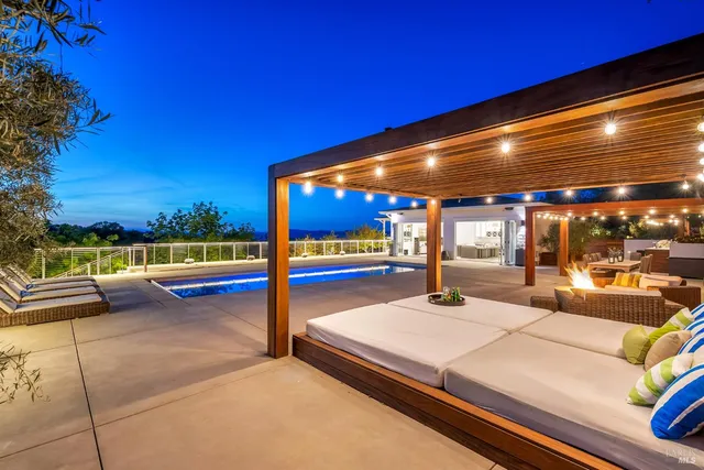a view of a patio with a table and chairs