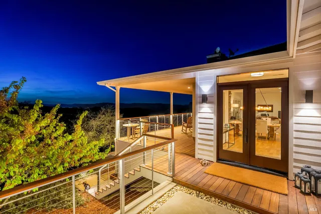 a view of a balcony with chairs