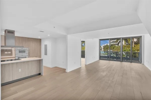 a view of kitchen with granite countertop cabinets and sink