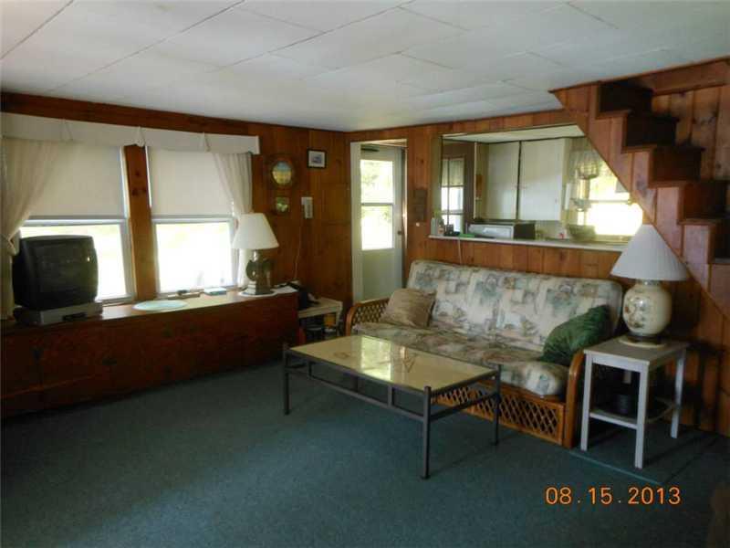 40 Rustic Drive Litchfield, ME 04350 - Photo 7 of 17 Living Room. The living room has...