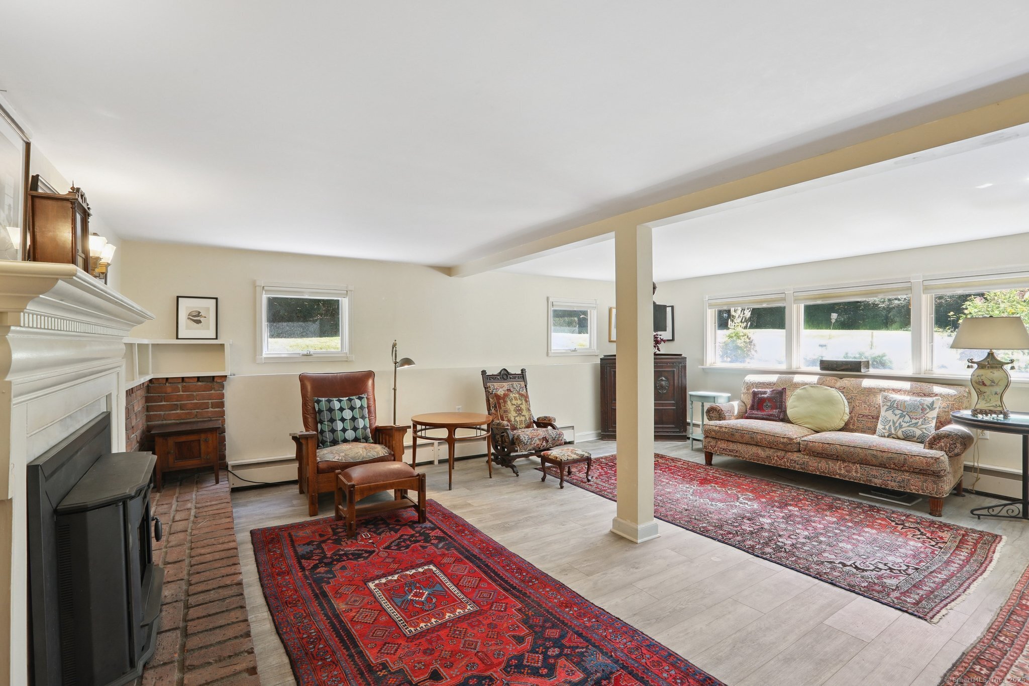62 Walnut Hill Road Bethel, CT 06801 - Photo 16 of 39 a living room with furniture windows and a fireplace
