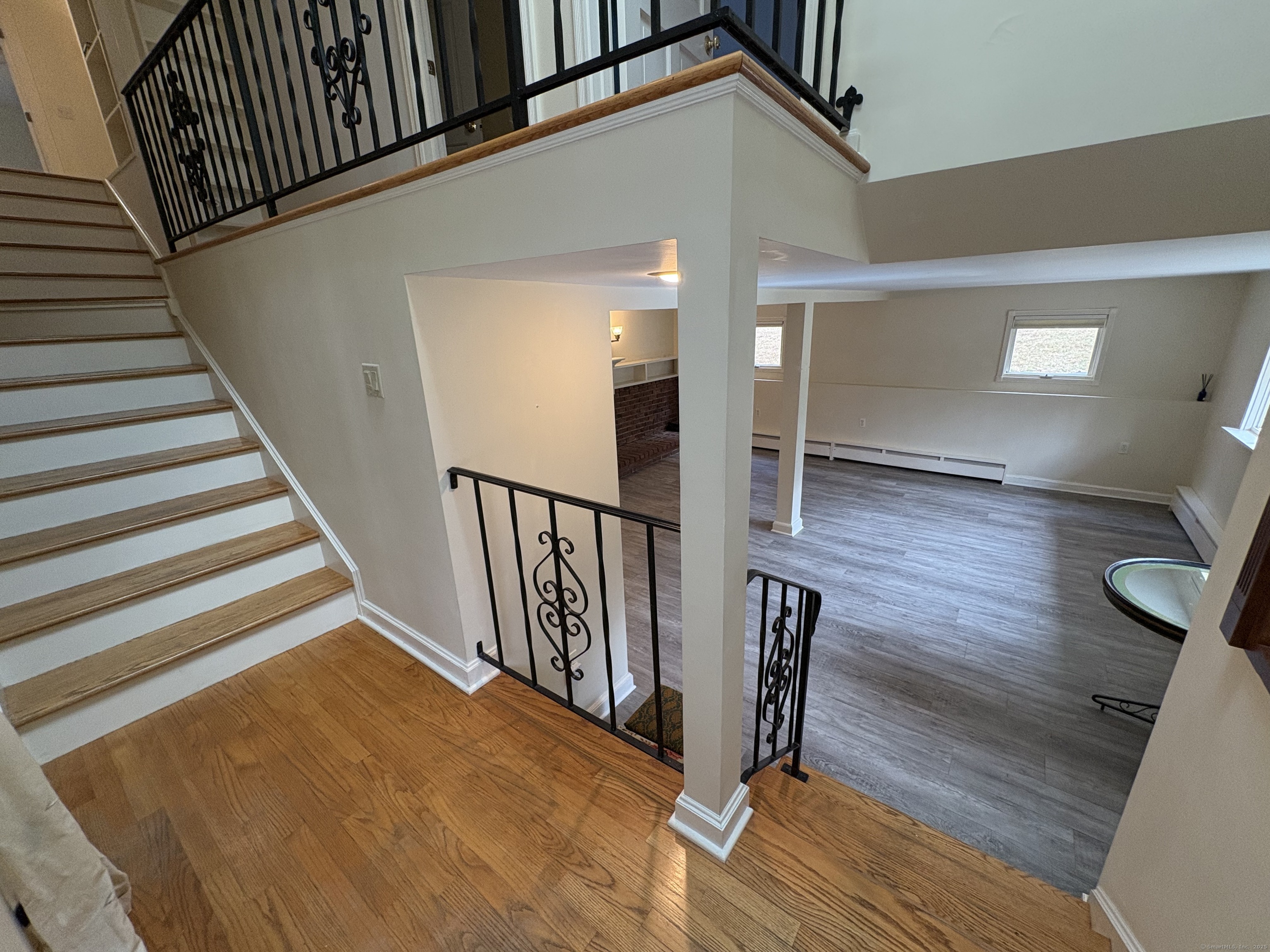 62 Walnut Hill Road Bethel, CT 06801 - Photo 19 of 39 a view of entryway with wooden floor and stairs