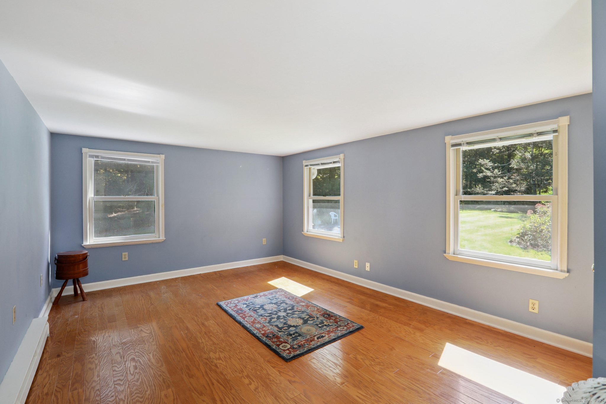 62 Walnut Hill Road Bethel, CT 06801 - Photo 20 of 39 a view of room with window and wooden floor
