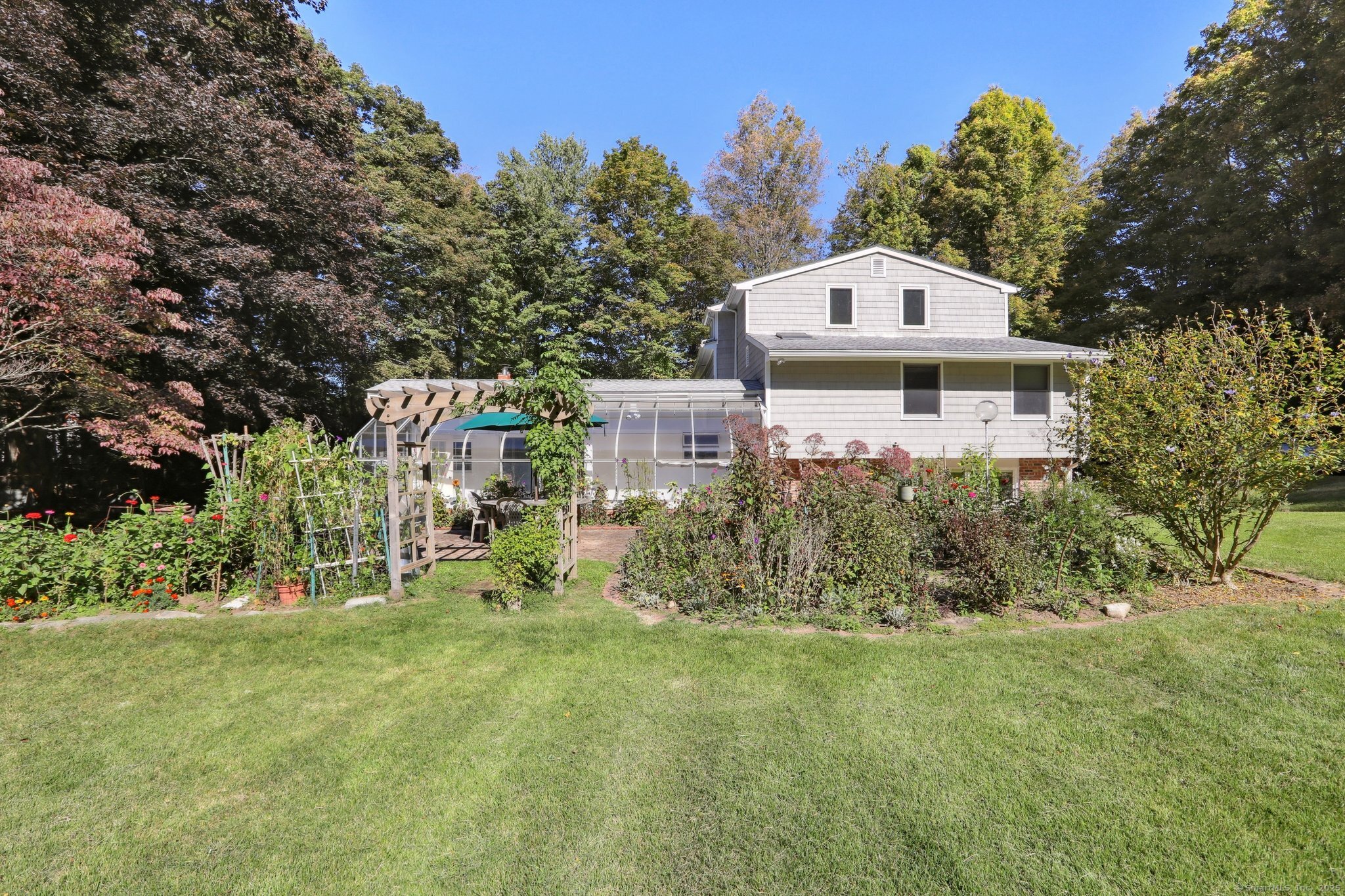 62 Walnut Hill Road Bethel, CT 06801 - Photo 2 of 39 a front view of a house with garden
