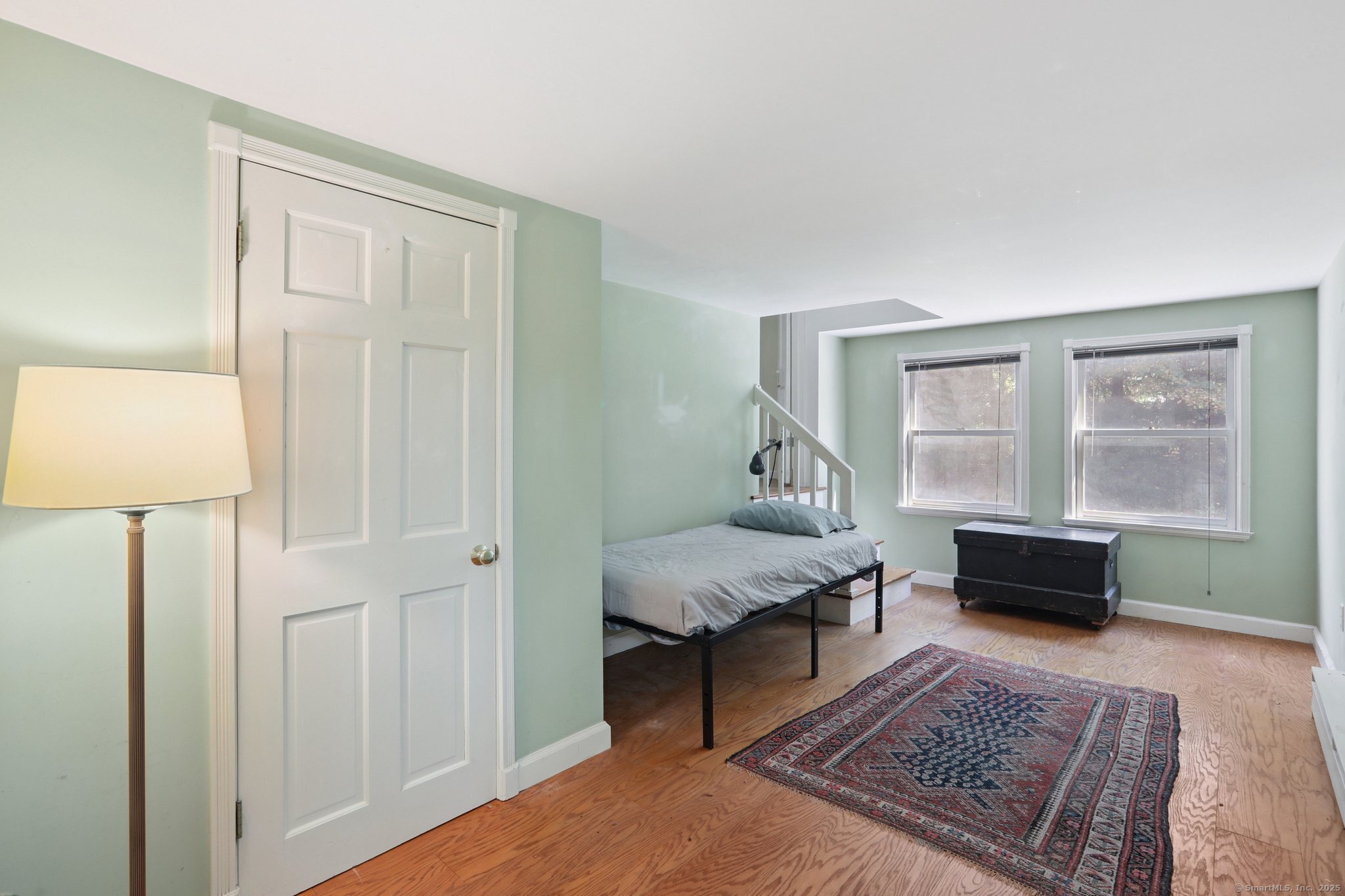 62 Walnut Hill Road Bethel, CT 06801 - Photo 22 of 39 a living room with furniture and a rug