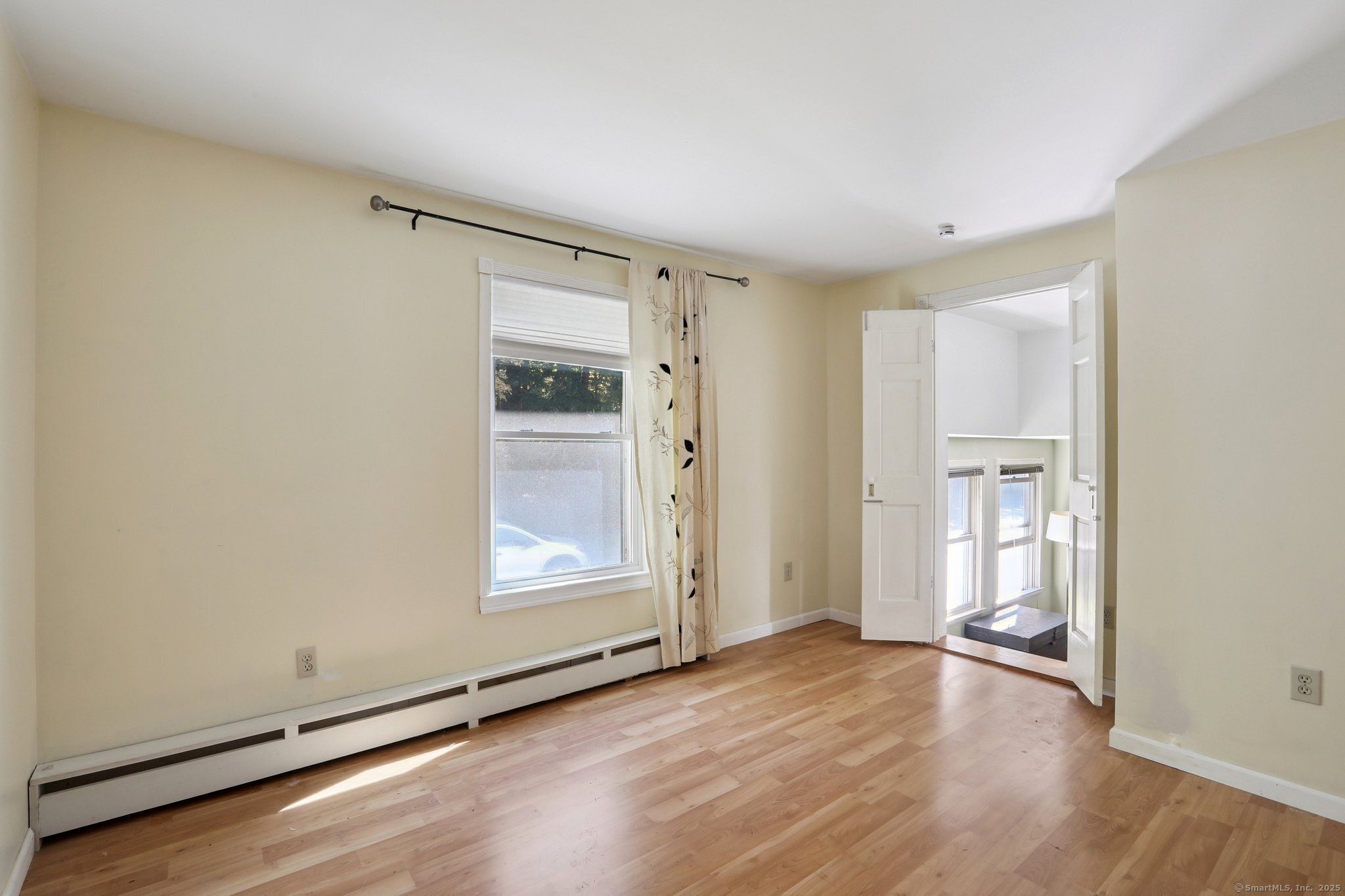 62 Walnut Hill Road Bethel, CT 06801 - Photo 23 of 39 an empty room with wooden floor and windows