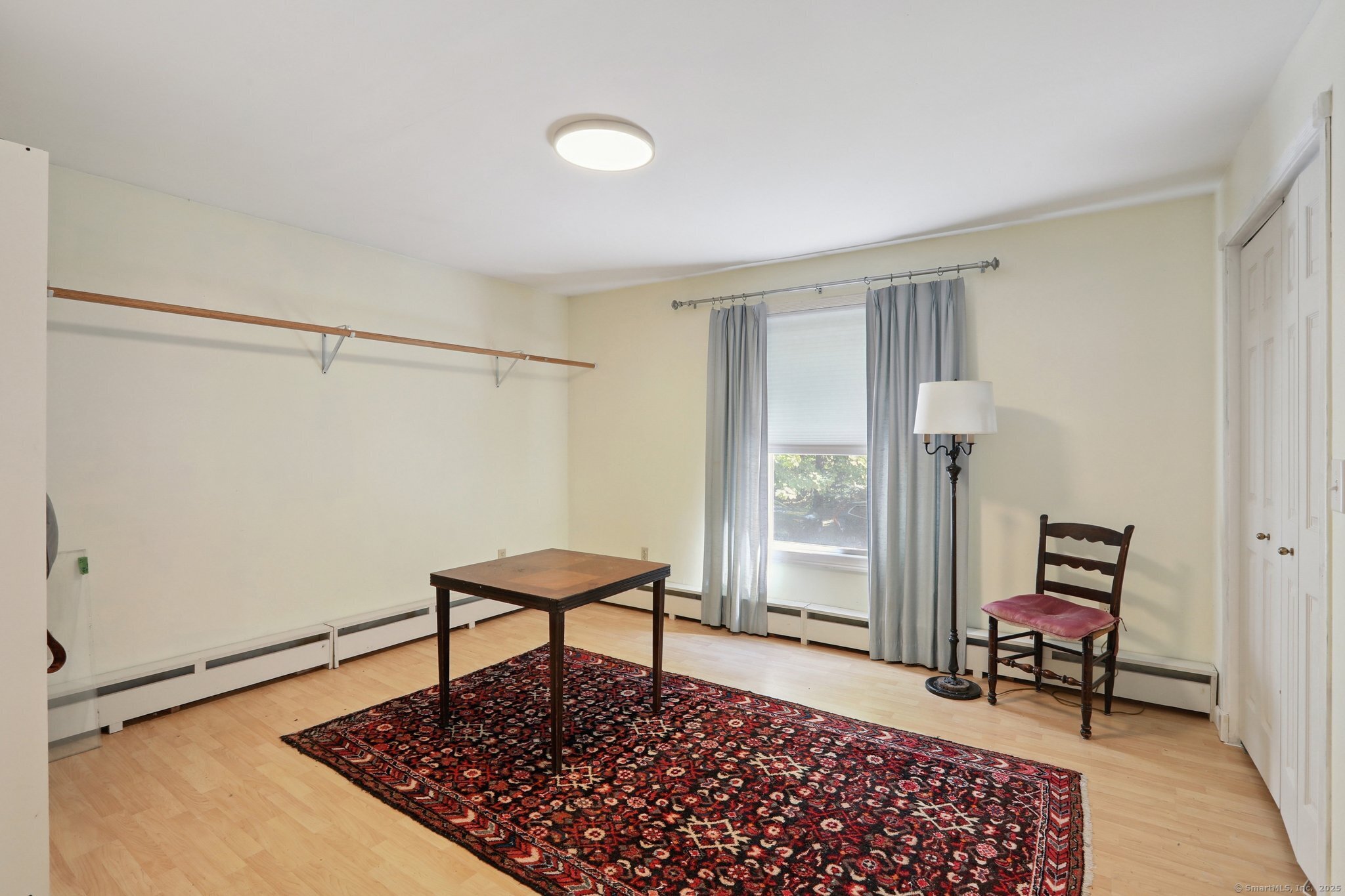 62 Walnut Hill Road Bethel, CT 06801 - Photo 26 of 39 a living room with a rug and a table