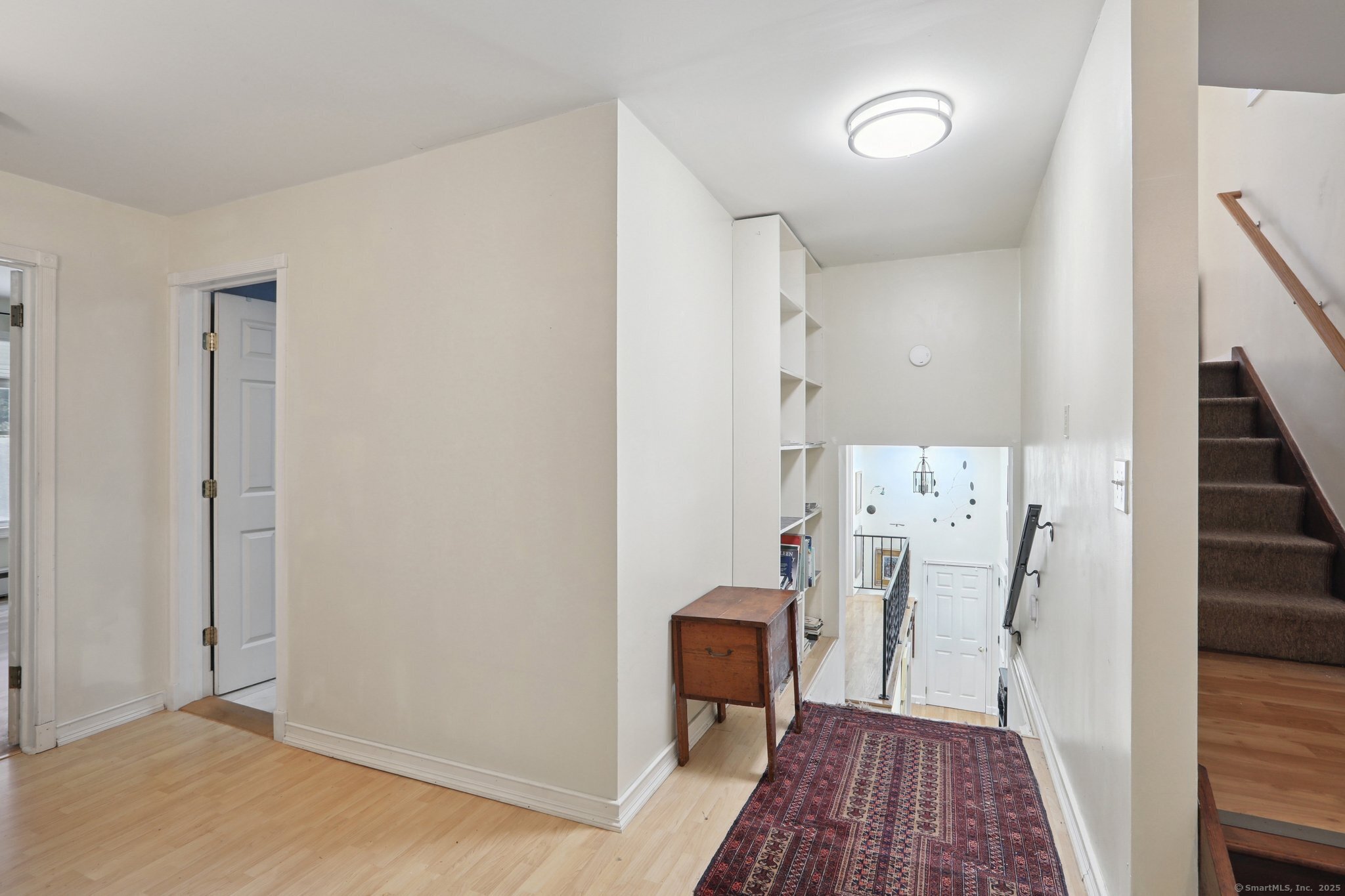 62 Walnut Hill Road Bethel, CT 06801 - Photo 27 of 39 a view of a hallway with wooden floor and staircase