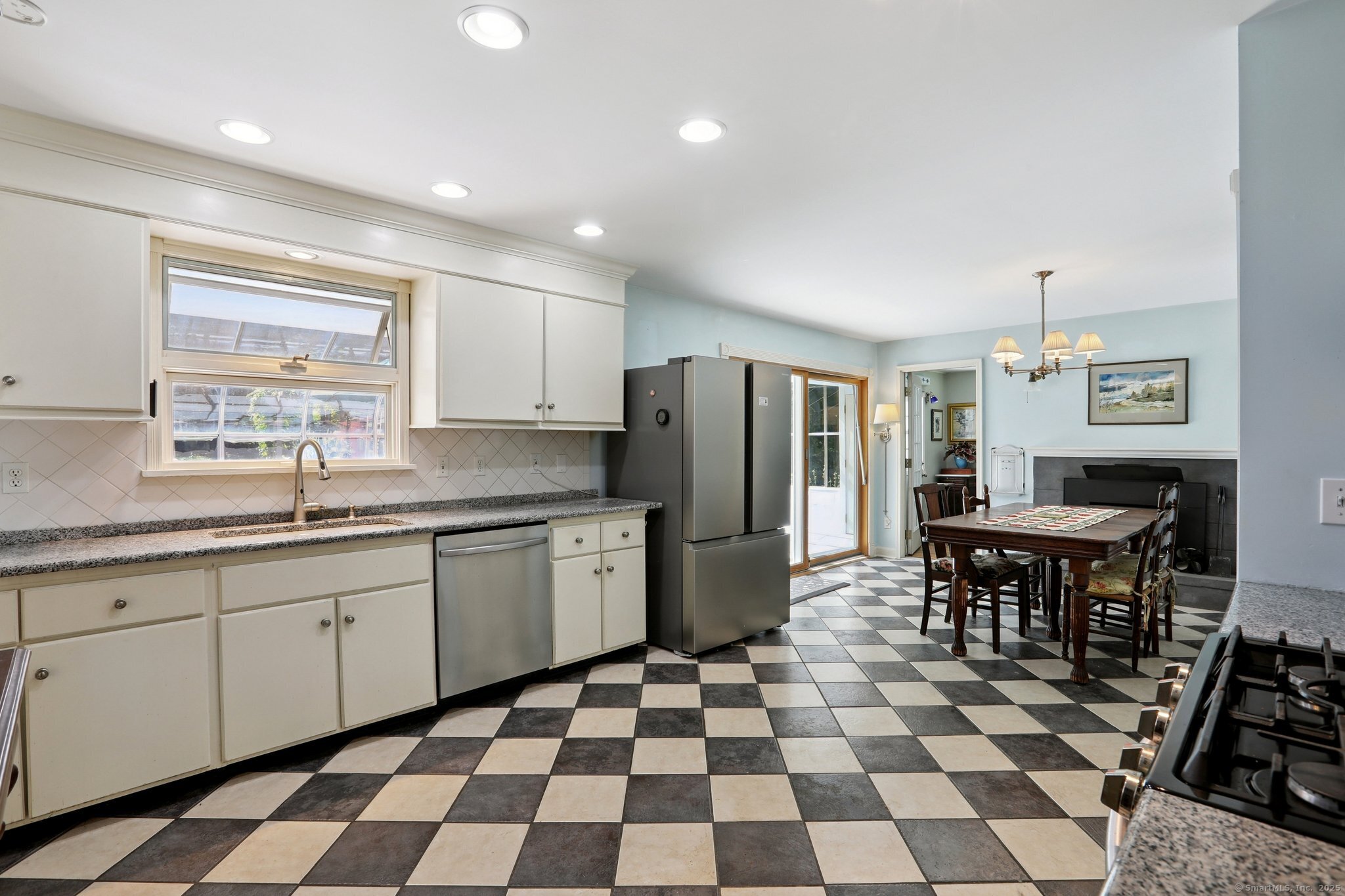 62 Walnut Hill Road Bethel, CT 06801 - Photo 7 of 39 a kitchen with a sink a table and chairs
