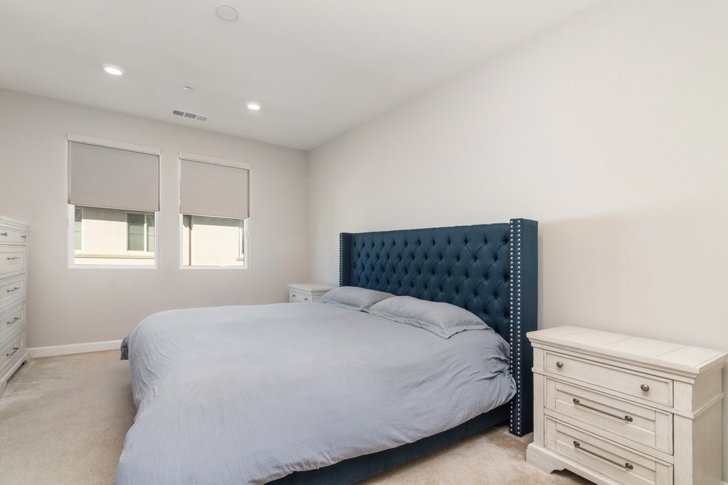 3573 Conner Way Oceanside, CA 92056 - Photo 20 of 25 a bedroom with a bed and a window