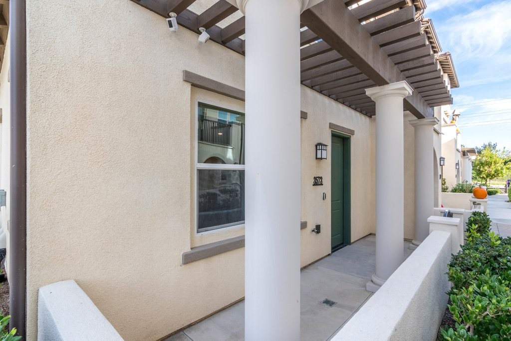 3573 Conner Way Oceanside, CA 92056 - Photo 3 of 25 a hallway with front door and wooden floor
