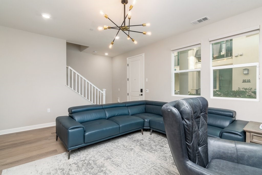 3573 Conner Way Oceanside, CA 92056 - Photo 5 of 25 a living room with furniture ceiling fan and a window
