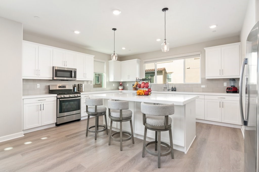 3573 Conner Way Oceanside, CA 92056 - Photo 8 of 25 a kitchen with a sink stainless steel appliances and cabinets