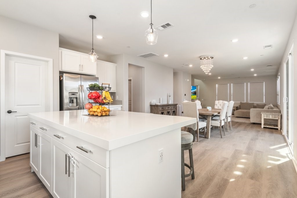 3573 Conner Way Oceanside, CA 92056 - Photo 9 of 25 a kitchen that has a lot of white furniture and a refrigerator