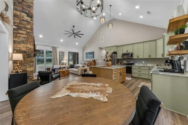 a spacious bedroom with a bed and a window