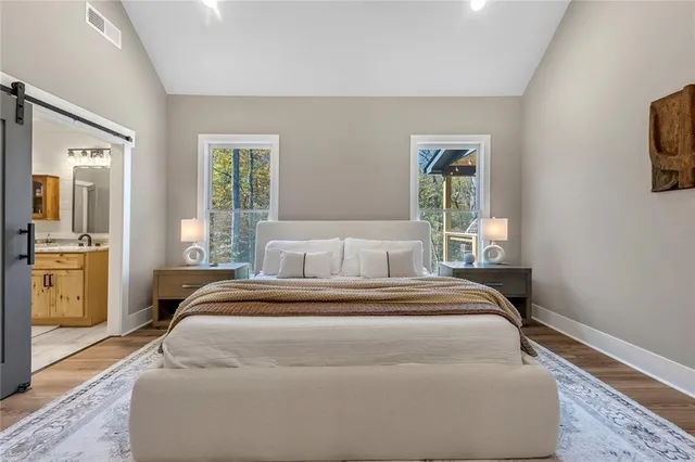 a bedroom with a bed and a dresser