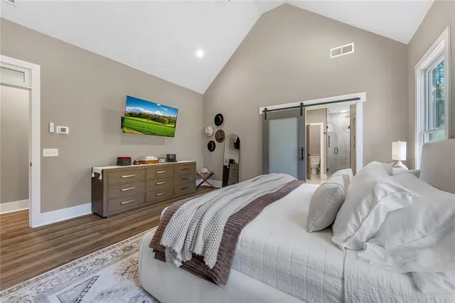 a bedroom with a bed and a dresser