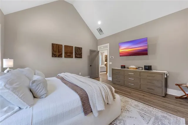 a spacious bathroom with a mirror sink and shower
