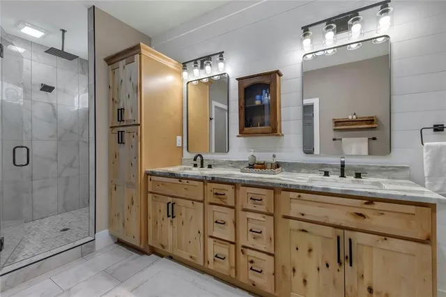 a bedroom with a bed and a ceiling fan