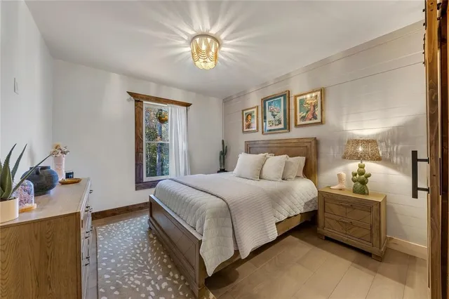 a view of a patio with a table chairs and wooden floor