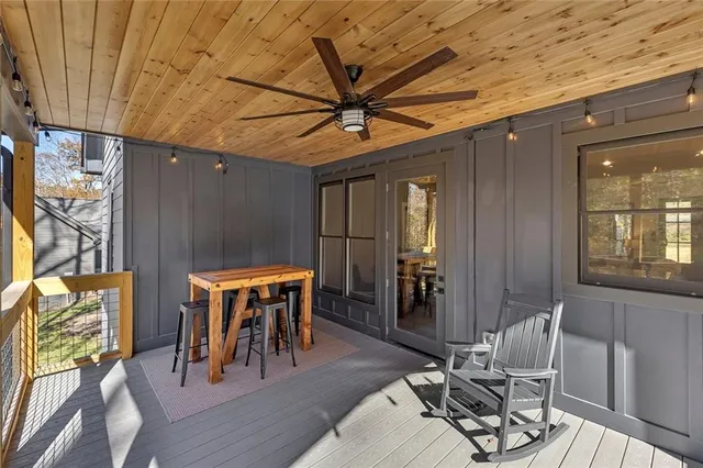 a view of a house with snow on the side of the road