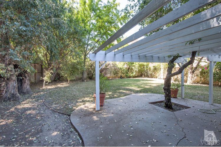 4739 Libbit Avenue Encino, CA 91436 - Photo 11 of 13 a view of a house with backyard and a tree