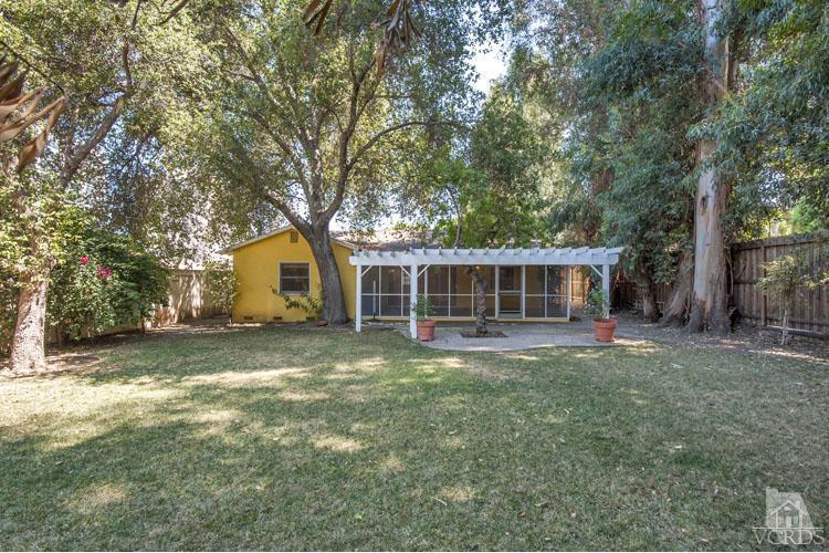 4739 Libbit Avenue Encino, CA 91436 - Photo 12 of 13 a view of a yard in front of a house with a large tree