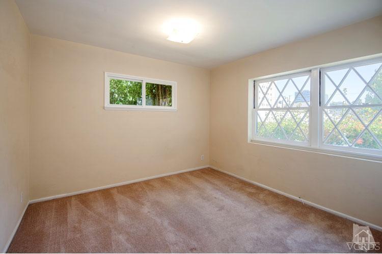 4739 Libbit Avenue Encino, CA 91436 - Photo 7 of 13 an empty room with a window