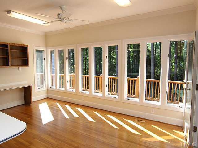 705 Sandown Place Raleigh, NC 27615 - Photo 5 of 12 Will this be your favorite room? The wall of windows floods the breakfast room with light, and you get a gorgeous view of the wooded backyard. Hard to believe you are in the hustle and bustle of North Raleigh here...very private, quiet and serene. Breakfast Area