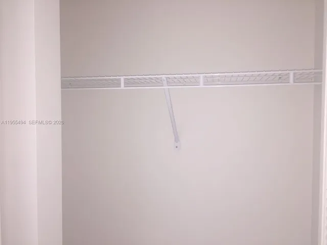 a view of a room with racks on the wall