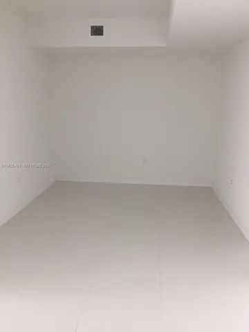 a kitchen with a sink stainless steel appliances and cabinets