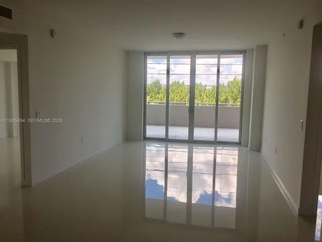 a view of kitchen with stainless steel appliances granite countertop
