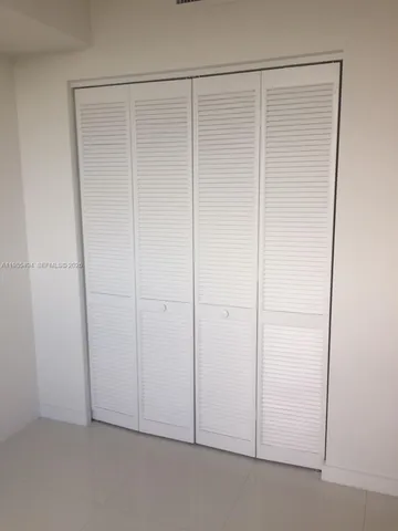 a bathroom with a sink toilet and a mirror