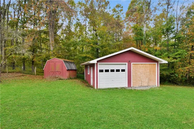 a view of a barn with a yard
