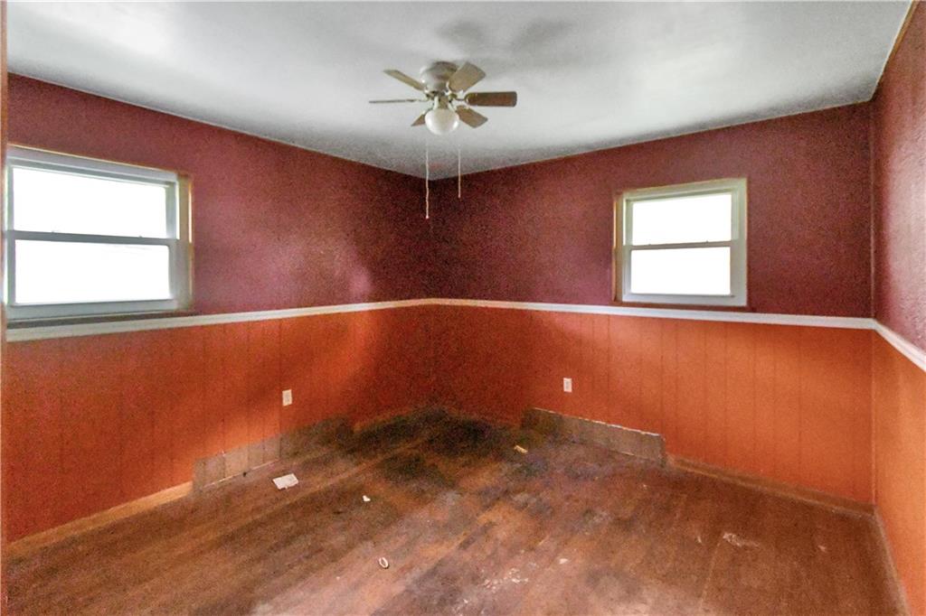 222 Gas Company Road Mount Morris, PA 15349 - Photo 21 of 34 an empty room with a window and a ceiling fan
