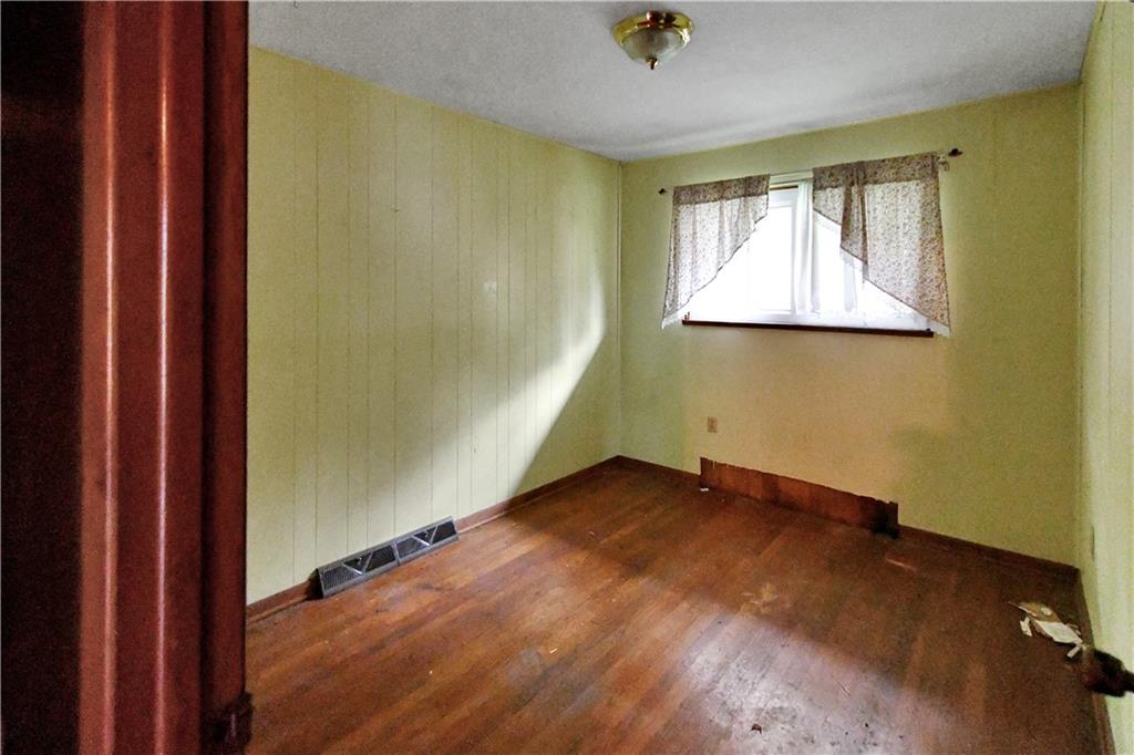 222 Gas Company Road Mount Morris, PA 15349 - Photo 24 of 34 an empty room with wooden floor and windows