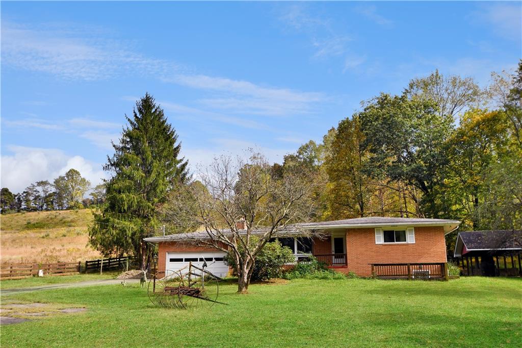222 Gas Company Road Mount Morris, PA 15349 - Photo 4 of 34 a front view of a house with garden