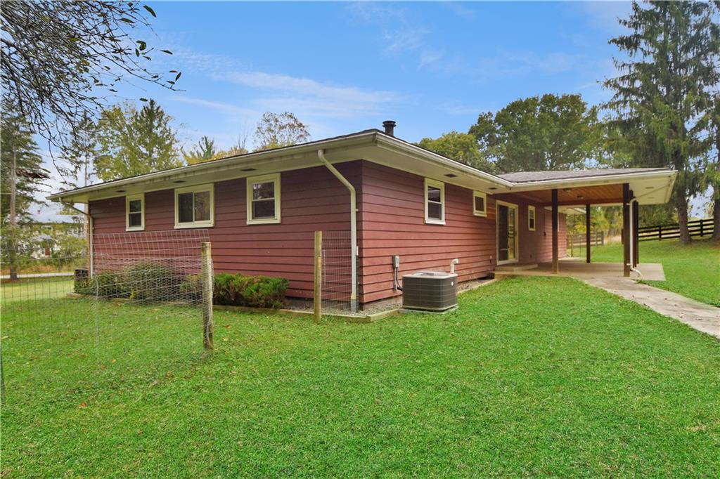 222 Gas Company Road Mount Morris, PA 15349 - Photo 9 of 34 a front view of a house with garden