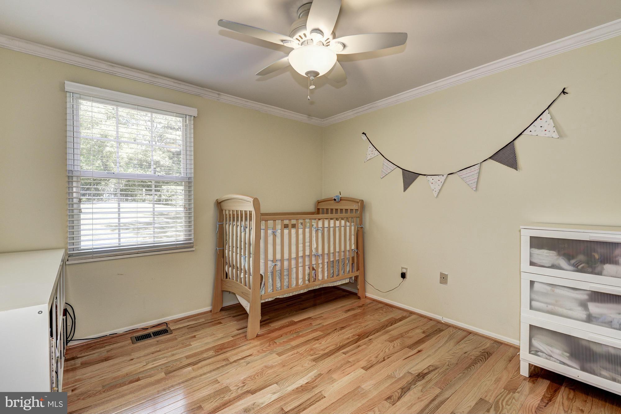1312 Wembrough Court Silver Spring, MD 20905 - Photo 14 of 28 a view of livingroom with hardwood floor and a ceiling fan
