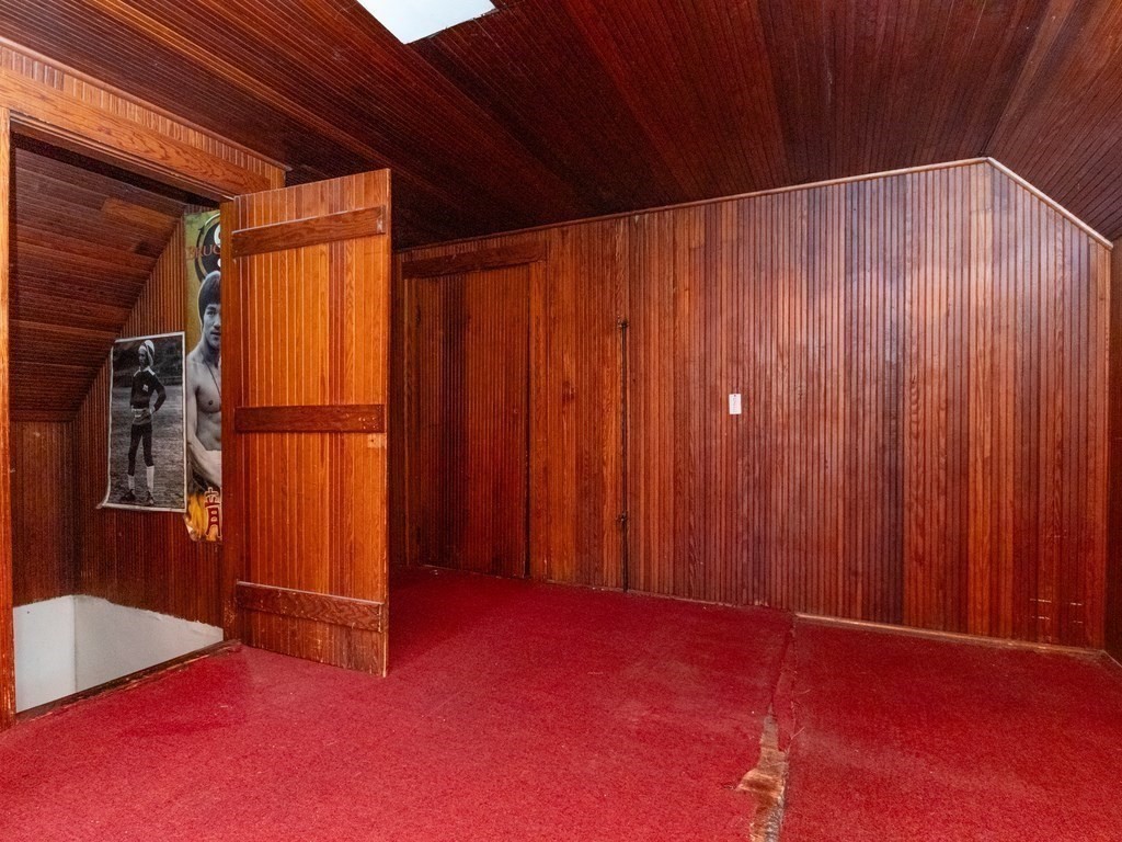 55 Baker Road Everett, MA 02149 - Photo 15 of 27 a view of an empty room with wooden walls