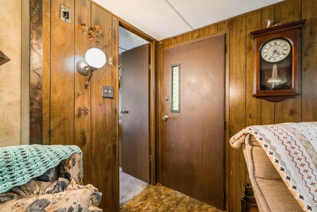 a view of bedroom with a bed and a closet