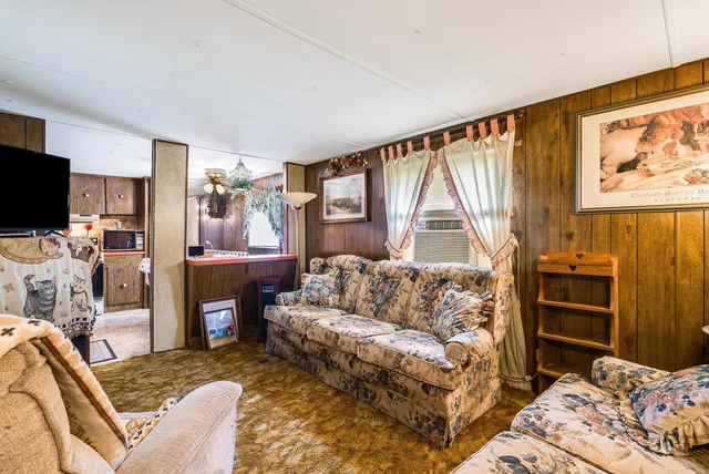 a bedroom with furniture and a window