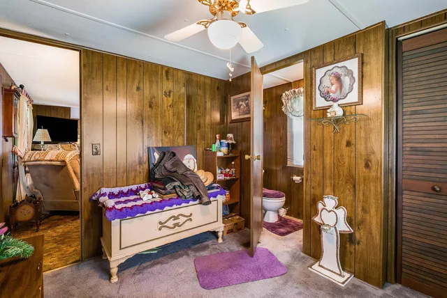 a bedroom with bed and a window