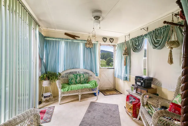 a view of a chair and table on the deck