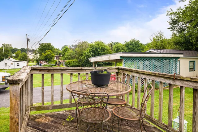a view of backyard with outdoor seating