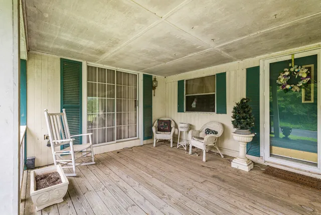 a view of a room with wooden floor and chair