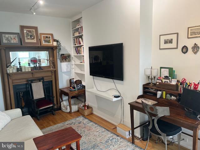 2107 S Street Northwest, Unit I Washington, DC 20008 - Photo 3 of 15 a living room with furniture a flat screen tv and a dining table