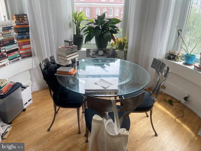 2107 S Street Northwest, Unit I Washington, DC 20008 - Photo 5 of 15 a dining room with furniture and wooden floor