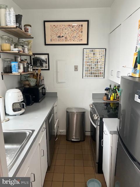 2107 S Street Northwest, Unit I Washington, DC 20008 - Photo 7 of 15 a kitchen with a sink cabinets and appliances