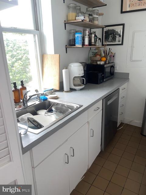 2107 S Street Northwest, Unit I Washington, DC 20008 - Photo 9 of 15 a kitchen with a sink cabinets and window